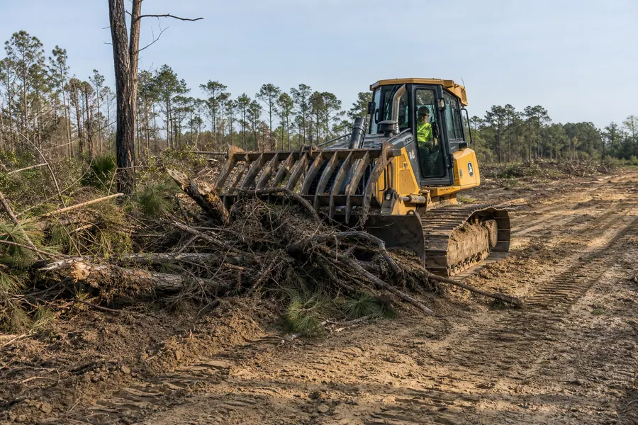 John Deere 700K LGP Dozer w/ Root Rake in action