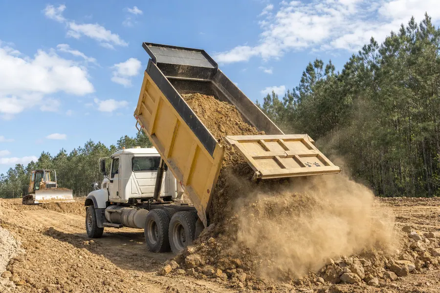 GMC CAT 3116 Tandem Axle Dump Truck in action