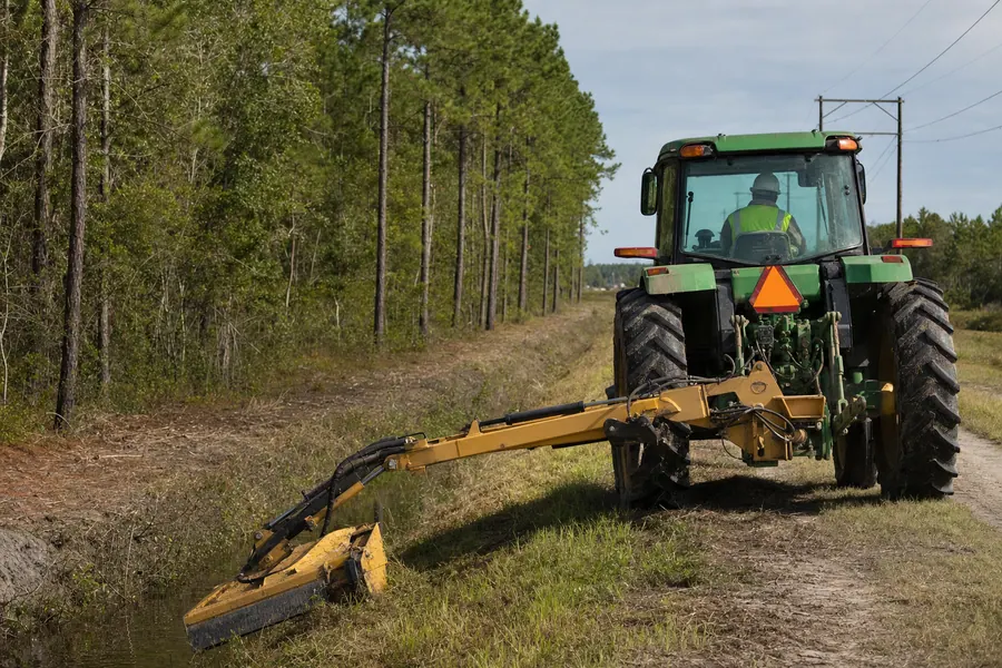 John Deere 6105 Tractor w/ Alamo Boom Mower in action